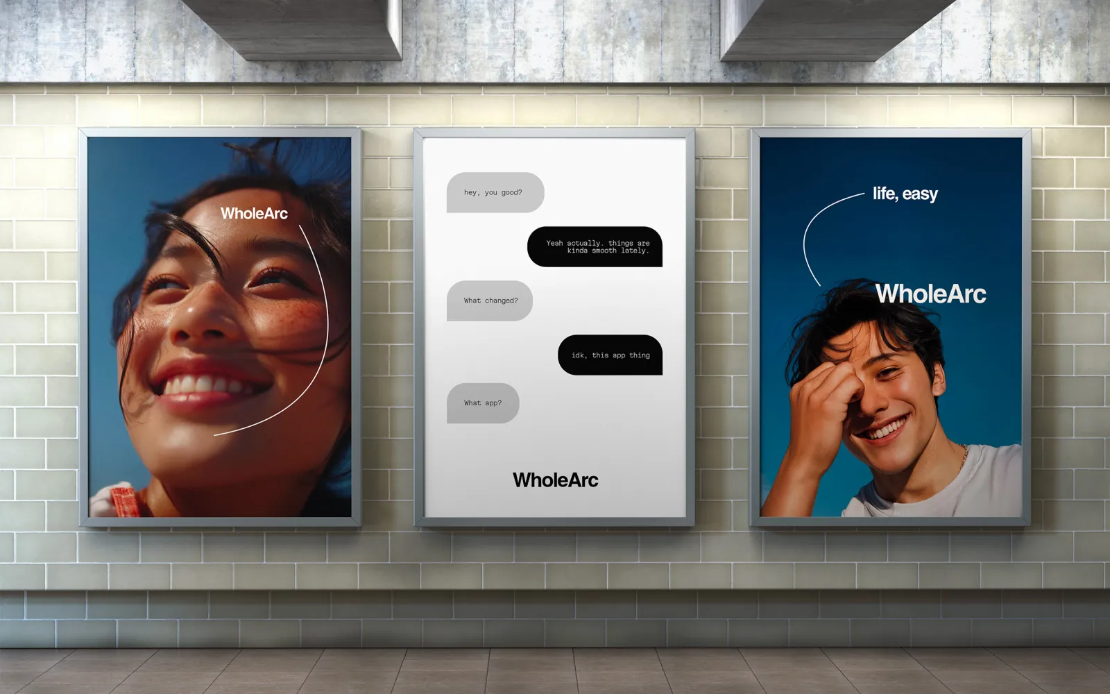 Three WholeArc posters in a subway station.