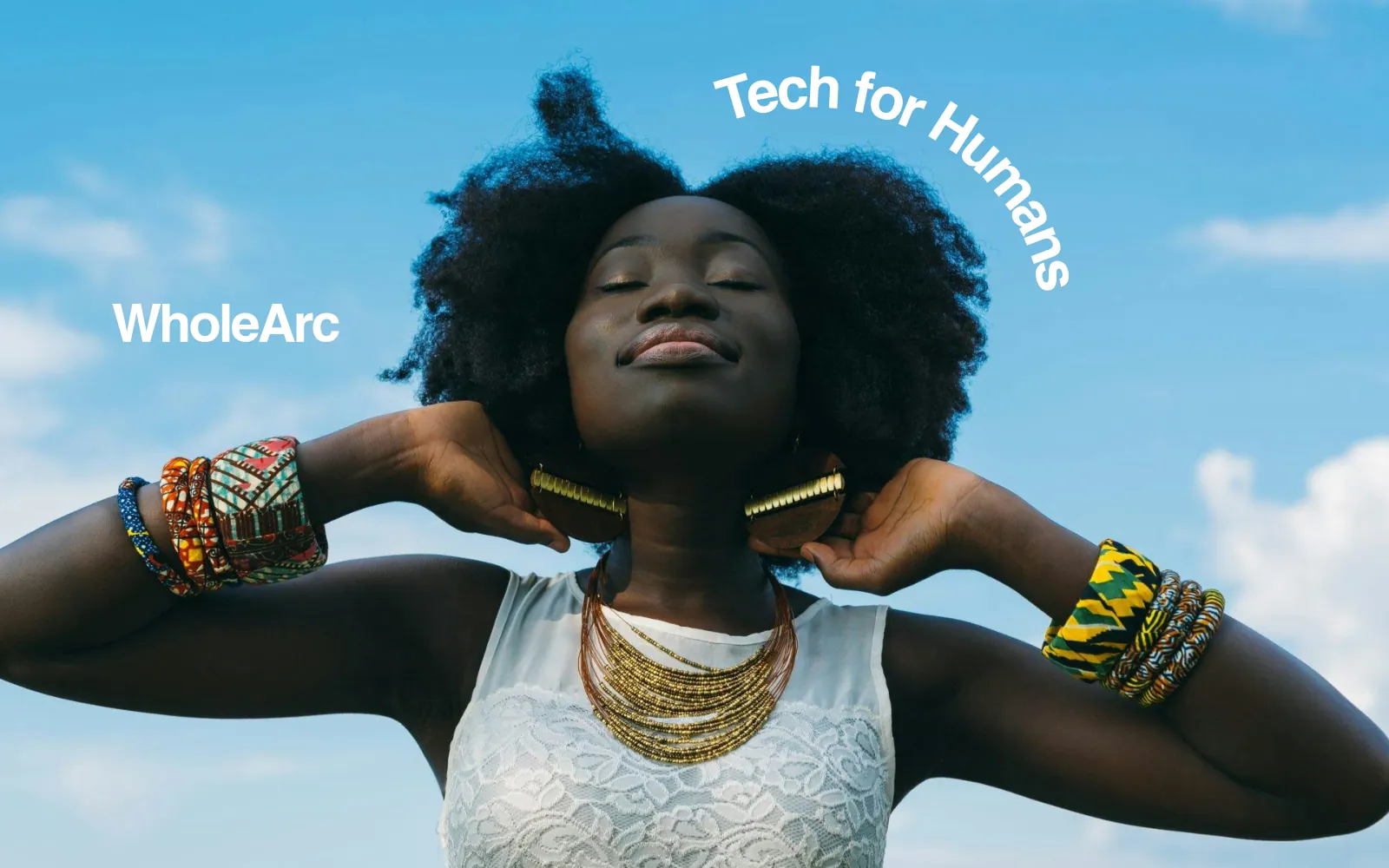 A woman in the sun beneath the line “Tech for Humans”.