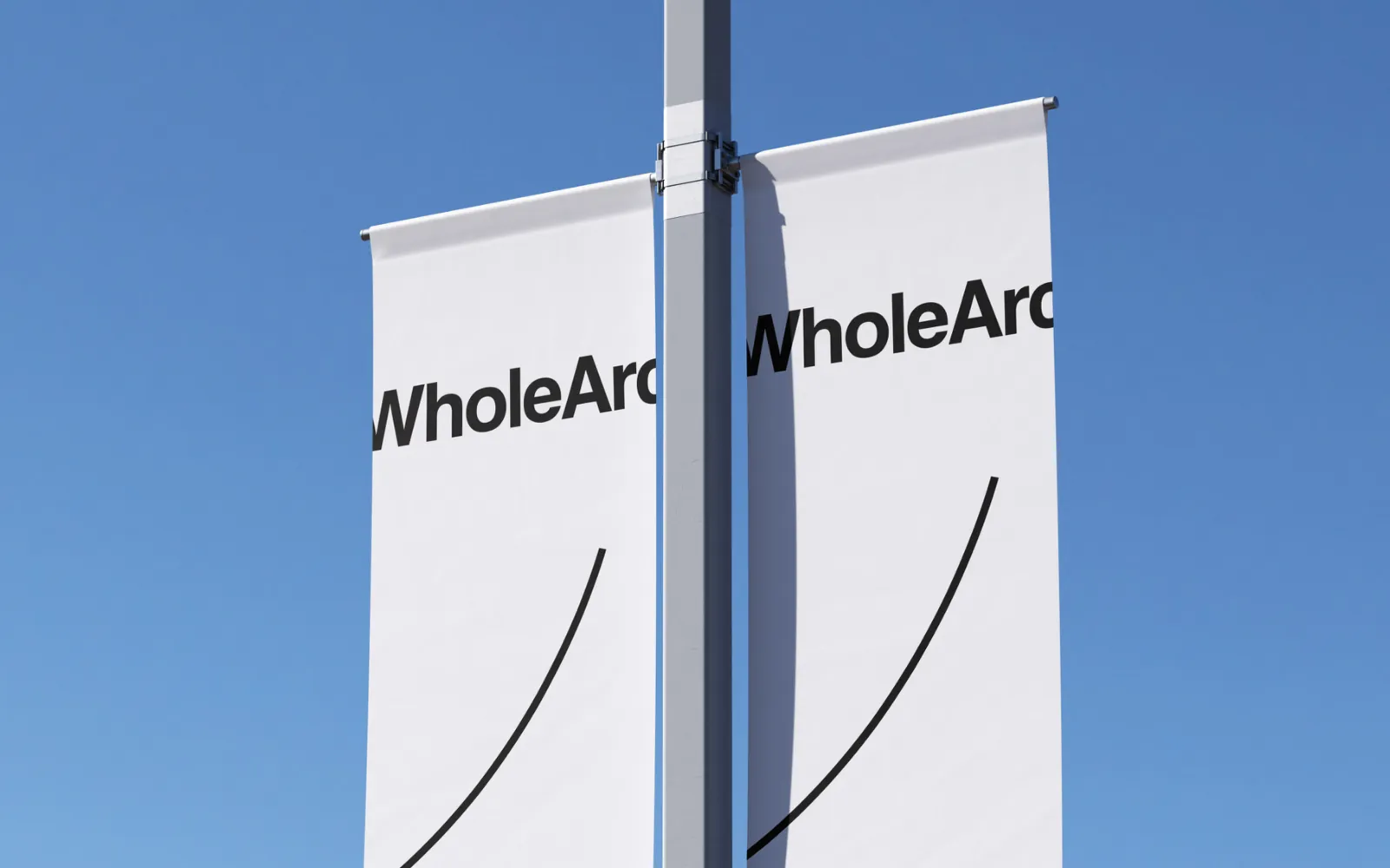 WholeArc street banners against a blue sky.