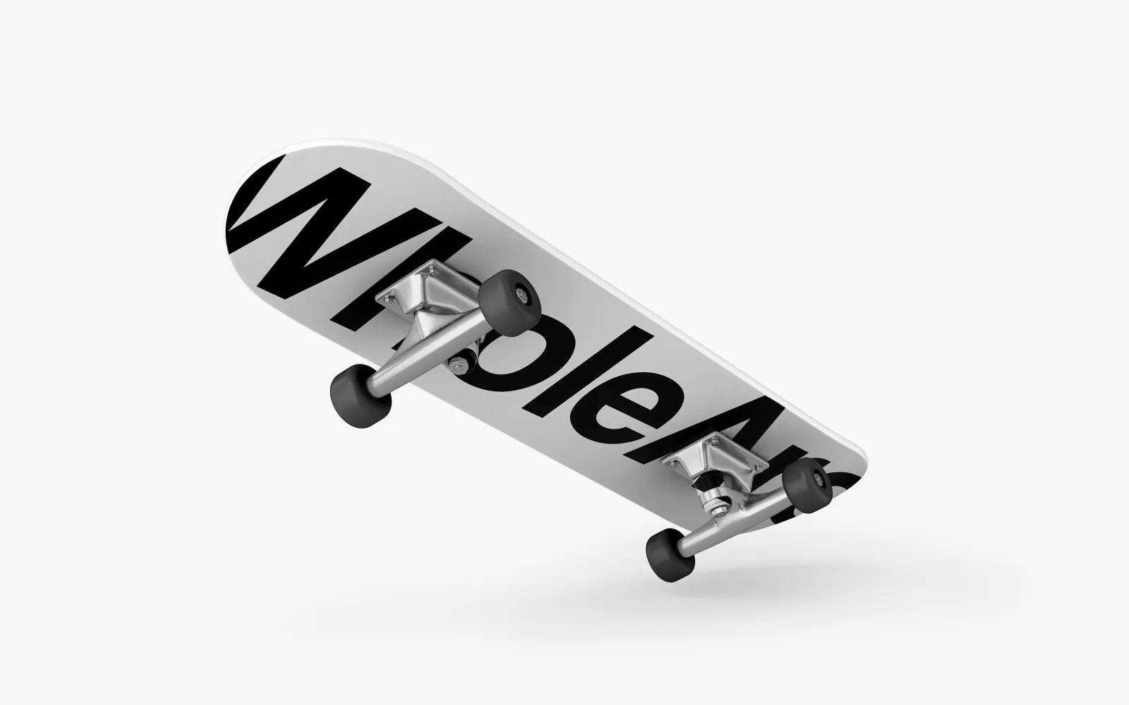 A skateboard carrying the WholeArc wordmark.