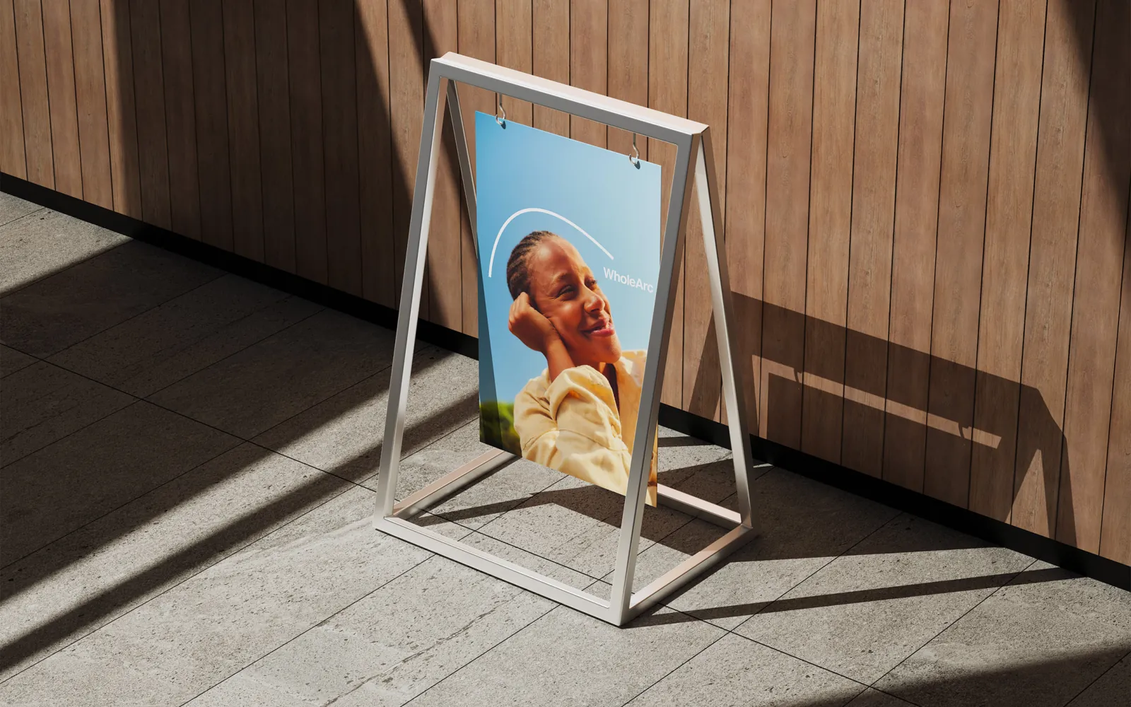 A poster of a smiling portrait framed by the arc.